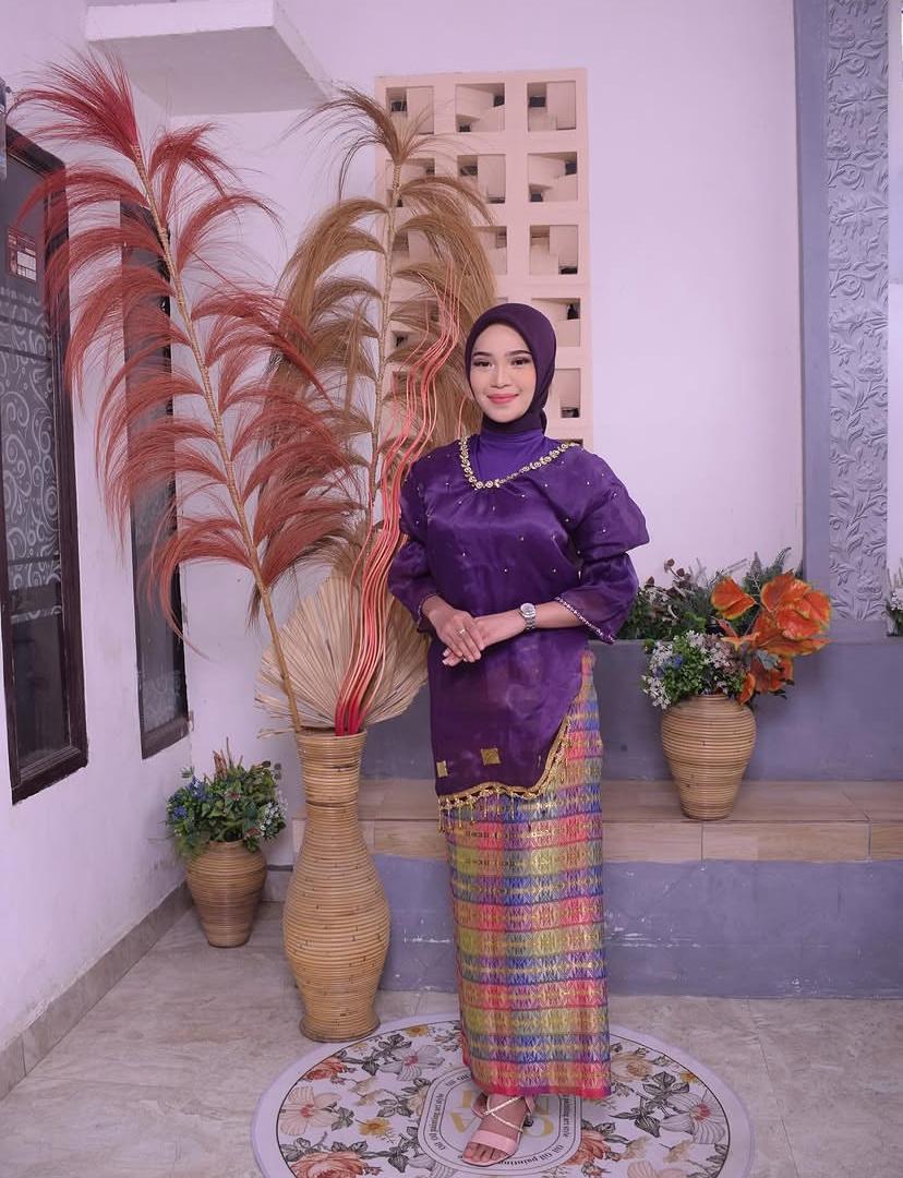 Baju bodo ungu